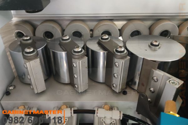 Cụm rulo ép nẹp máy dán cạnh 9 chức năng keo PUR