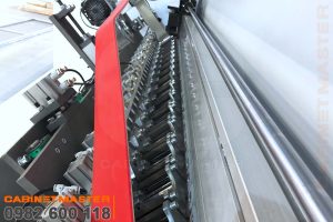băng tải rulo ép nghiêng máy dán cạnh nghiêng noline