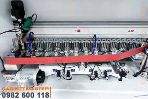 rulo băng tải ép nẹp thẳng máy dán cạnh noline thẳng nghiêng keo AB